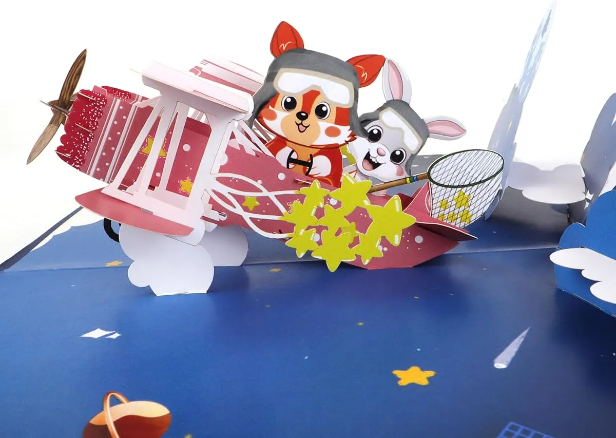 A CutePopup card seen from the side, cut paper layers standing up from the fold