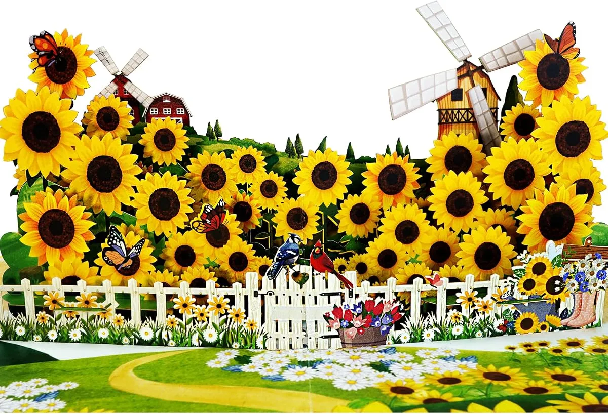 A CutePopup card opened flat, a whole sunflower field in cut paper rising from the fold